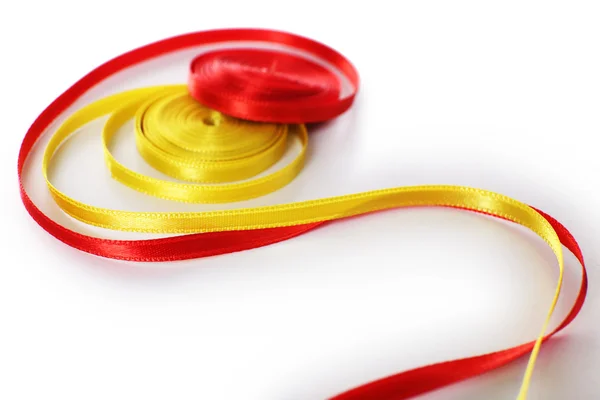 Colorful red and yellow ribbons isolated on white — Stock Photo, Image