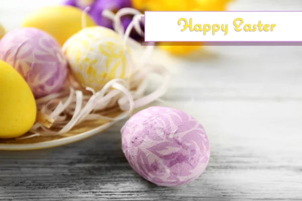 Easter composition with colorful eggs on wooden table background — Stock Photo, Image