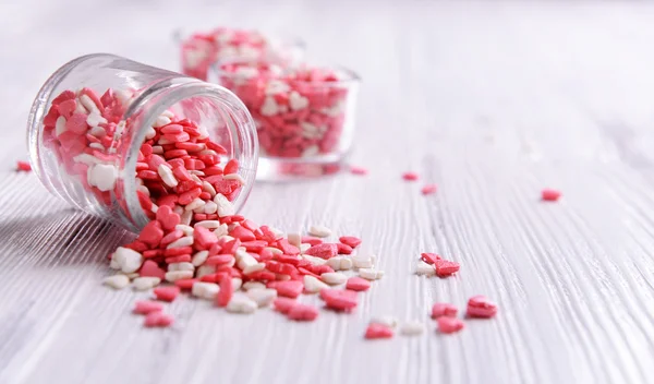 Colorful sprinkles in bowls on table close-up — Stock Photo, Image