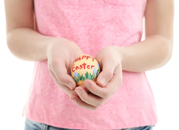 Girl holding painted egg in her hands, close-up, isolated on white — Stock Photo, Image
