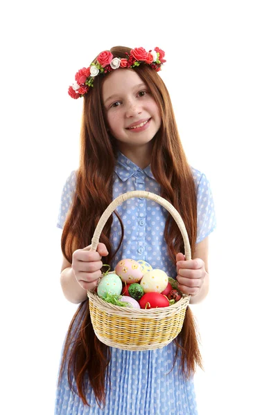 Beautiful little girl holding wicker basket with Easter eggs, isolated on white — Stock Photo, Image