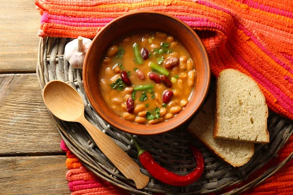 Bean soup in bowl on wooden table background — Stock Photo, Image