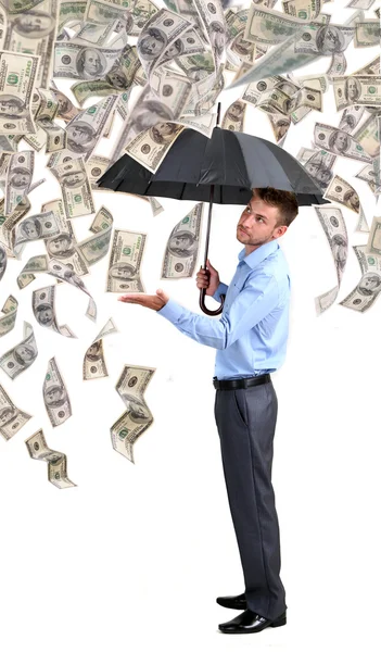 Businessman standing in the rain of money — Stock Photo, Image