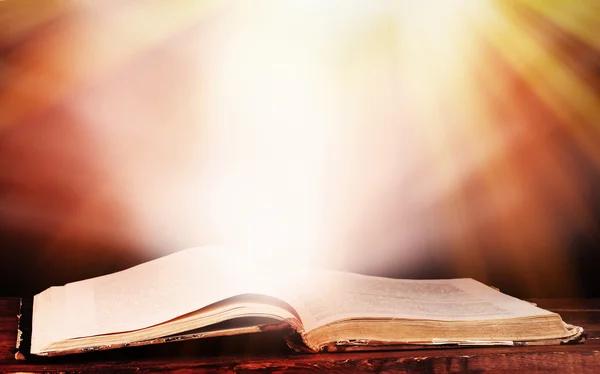 Opened book on table on brown background — Stock Photo, Image