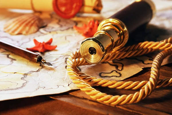 Marine still life with world map on wooden table background — Stock Photo, Image