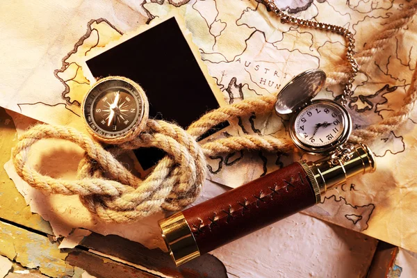 Marine still life spyglass and world map on old wooden background — Stock Photo, Image