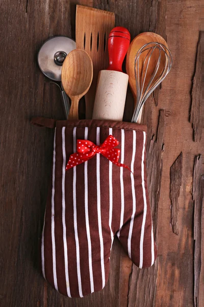 Set of kitchen utensils on rustic wooden table background — Stock Photo, Image