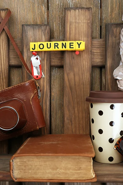 Set of tourist with word Journey on wooden planks background — Stock Photo, Image