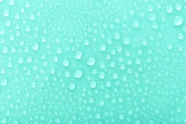 Gotas de água em vidro no fundo verde — Fotografia de Stock