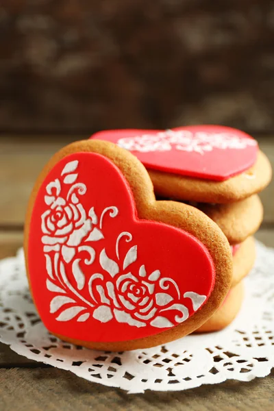 Heart shaped cookies for valentines day on napkin, on color wooden background — Stock Photo, Image