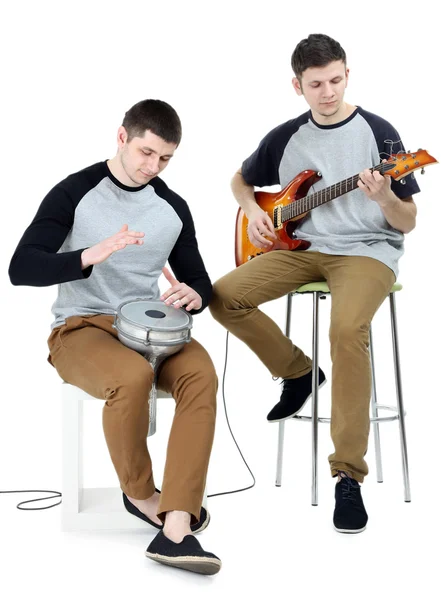 Two handsome young men with musical instruments isolated on white — Stock Photo, Image