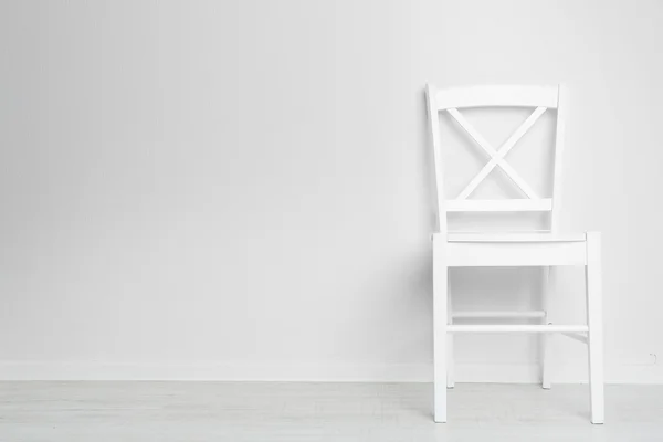 Modern chair on white wall background — Stock Photo, Image