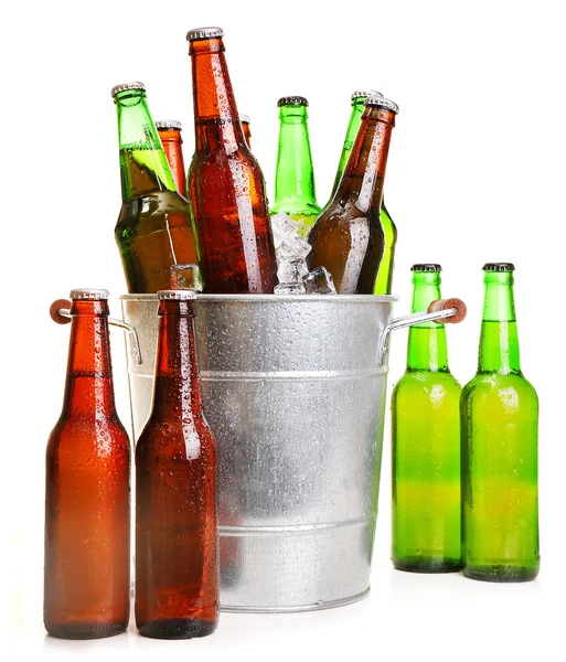 Glass bottles of beer in metal bucket isolated on white — Stock Photo, Image