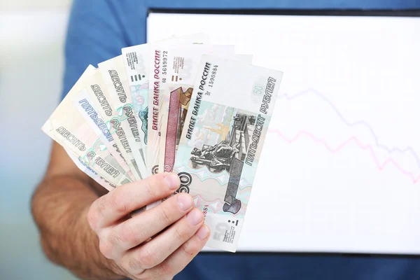 Man holding money and graph document close up — Stock Photo, Image