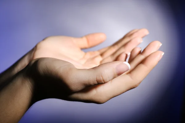 Woman praying on bright background — Stock Photo, Image