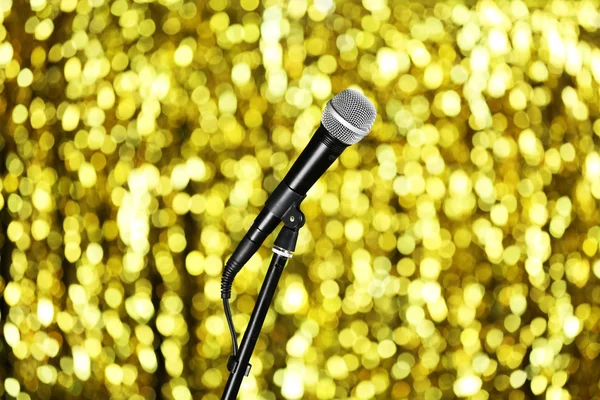 Microphone on stand on golden background — Stock Photo, Image