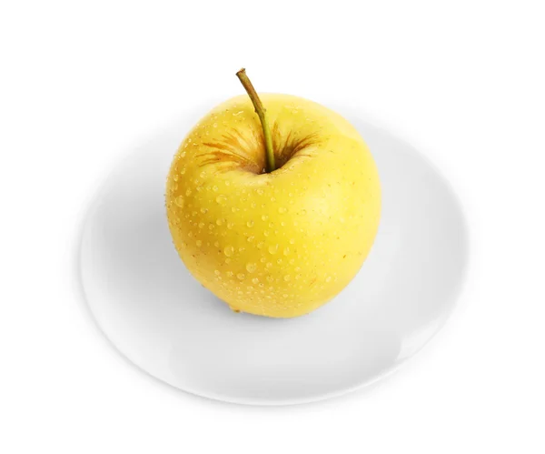 Pomme sur soucoupe isolée sur blanc — Photo