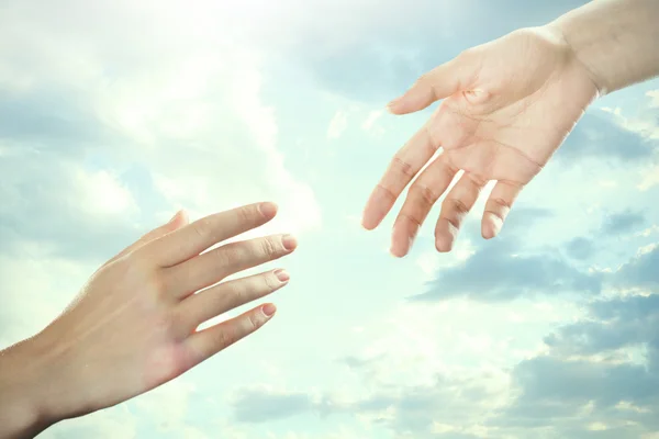 Human hands on sky background — Stock Photo, Image