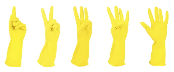 Κίτρινα γάντια χειρονομώ αριθμούς που απομονώνονται σε λευκό — Φωτογραφία Αρχείου