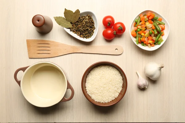 Food ingredients and kitchen utensils for cooking on wooden background — Stock Photo, Image