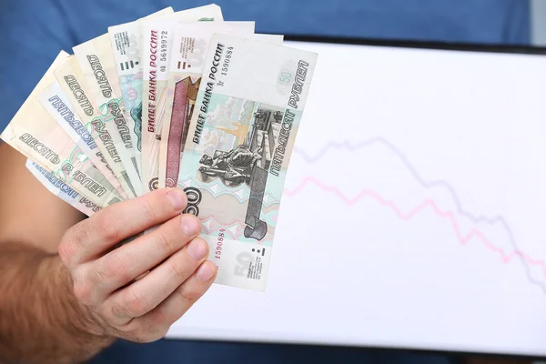 Man holding money and graph document close up — Stock Photo, Image