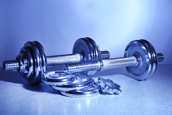 Dumbbells on floor background — Stock Photo, Image