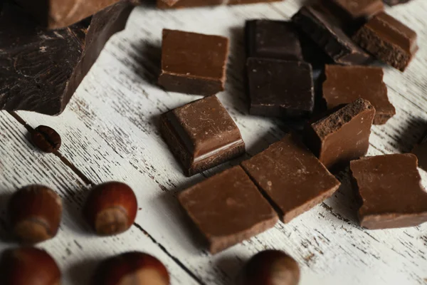 Set of chocolate on wooden table, closeup — Stock Photo, Image