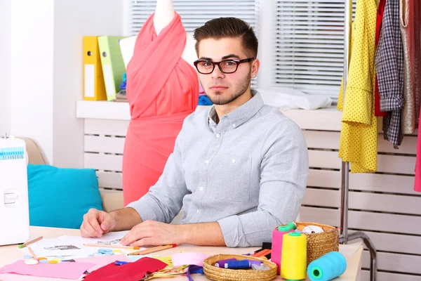 Young man fashion designer in atelier — Stock Photo, Image