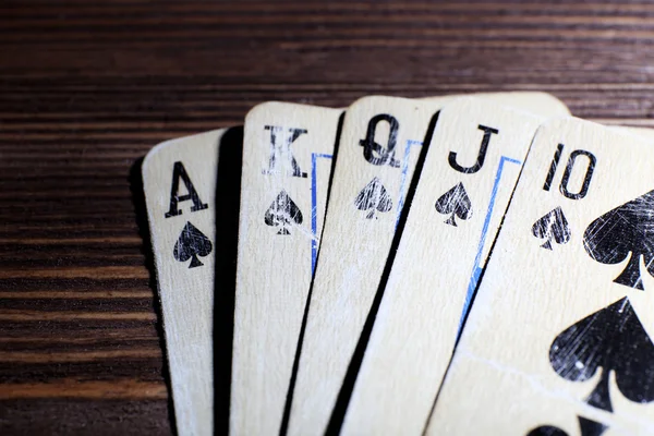 Playing cards on wooden table, closeup — Stock Photo, Image