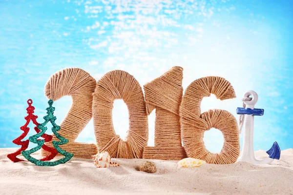 New year 2016 sign on beach sand — Stockfoto