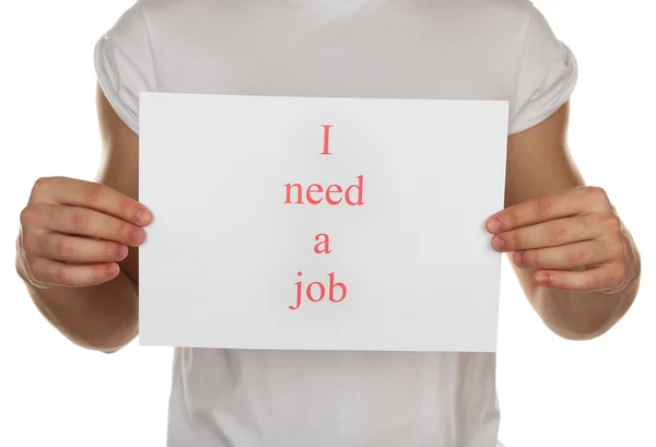 Vel papier met inscriptie een baan in mannelijke handen geïsoleerd op wit Ibehoefte — Stockfoto