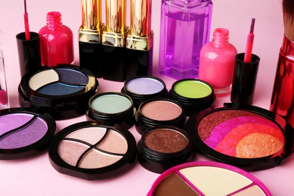 Set of decorative cosmetics on light colorful background — Stock Photo, Image