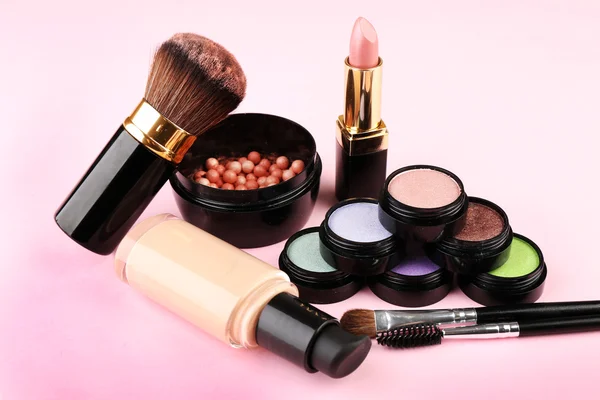 Set of decorative cosmetics on light colorful background — Stock Photo, Image