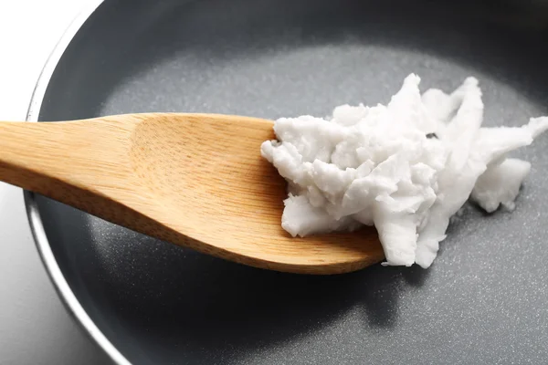 Coconut oil in frying pan close up — Stock Photo, Image