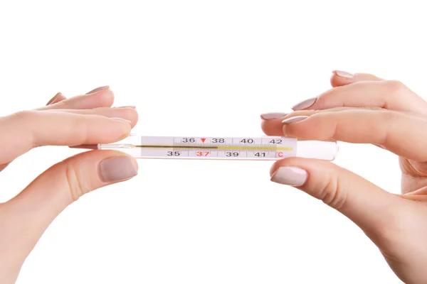 Frauenhände halten Thermometer isoliert auf weiß — Stockfoto