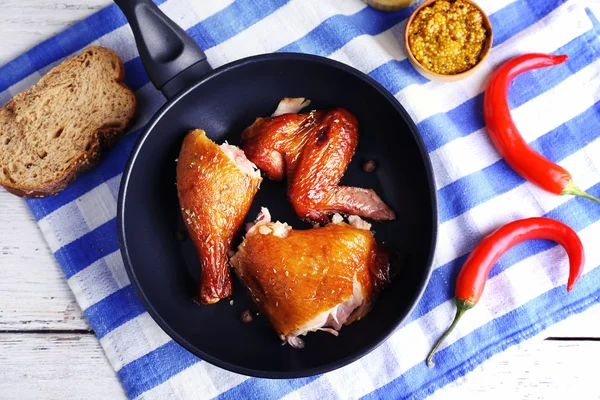 Smoked chicken with vegetables and mustard on pan on table close up — Stock Photo, Image