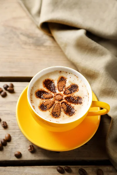 Cup of coffee on old wooden table — Stock Photo, Image