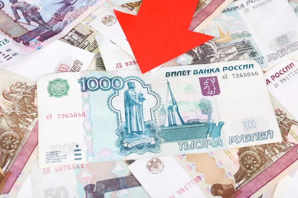 Red arrow on Russian money as depreciation of currency, closeup — Stock Photo, Image