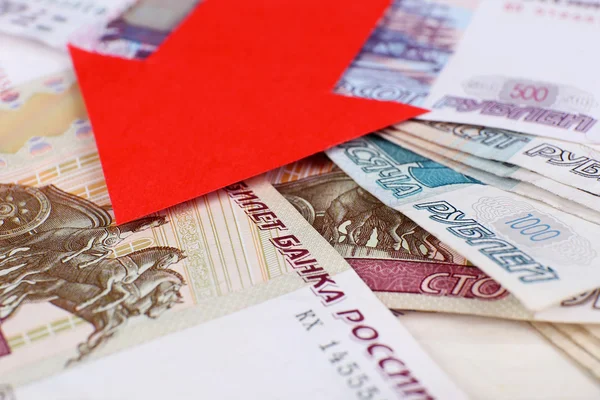 Red arrow on Russian money as depreciation of currency, closeup — Stock Photo, Image