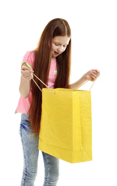 Beautiful little girl with shopping bag, isolated on white — Stock Photo, Image