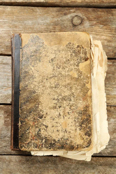 Old book on wooden table — Stock Photo, Image