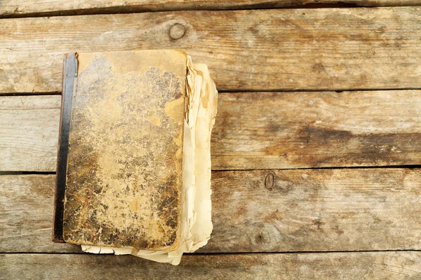 Old book on wooden table — Stock Photo, Image