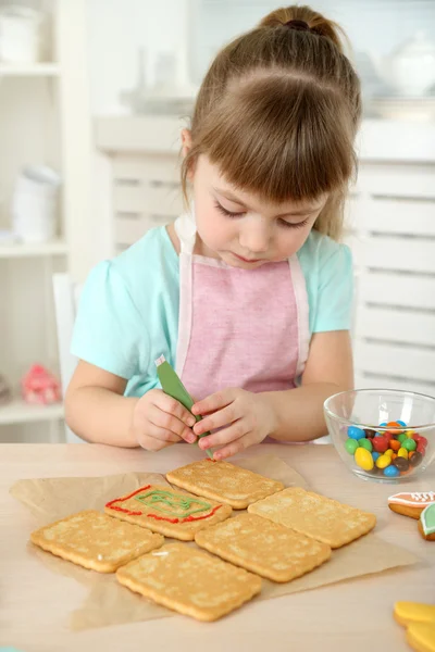 Little girl preparing cookies in kitchen at home — Stock Photo, Image