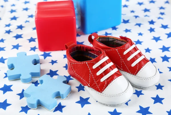 Baby shoes on spotted white background — Stock Photo, Image