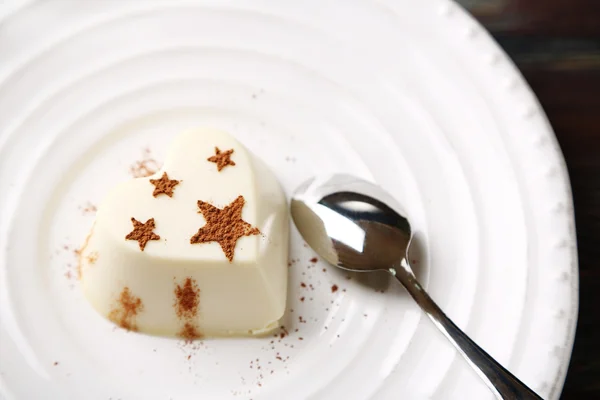 Tasty panna cotta dessert on plate, close up — Stock Photo, Image