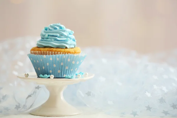 Sweet cupcake on table on light background — Stock Photo, Image