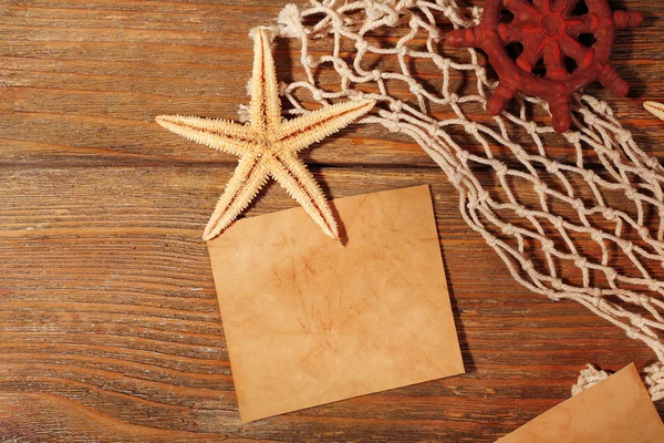 Card blank with sea star on wooden background — Stock Photo, Image