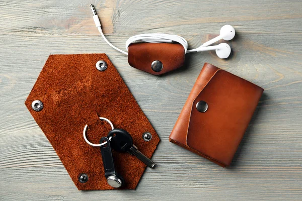 Hand made leather man accessories on wooden background