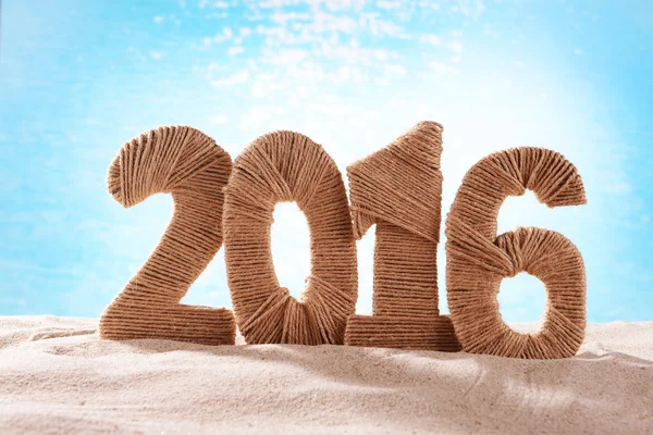 New year 2016 sign on beach sand — Stockfoto