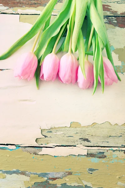 Beautiful pink tulips on wooden background — Stock Photo, Image